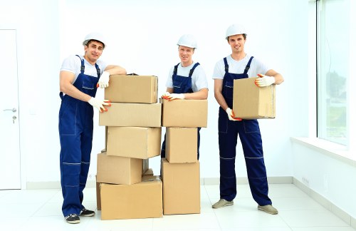 Moving team handling furniture during flat removals in Thehale