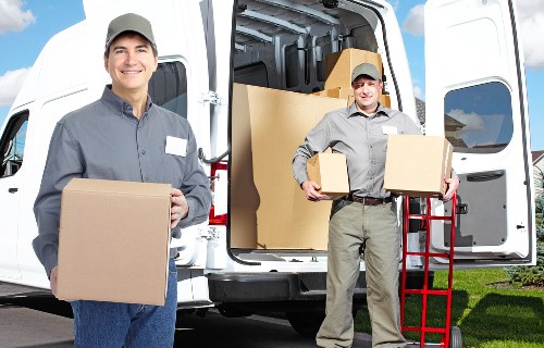 Experienced movers handling furniture during local removals in Thehale